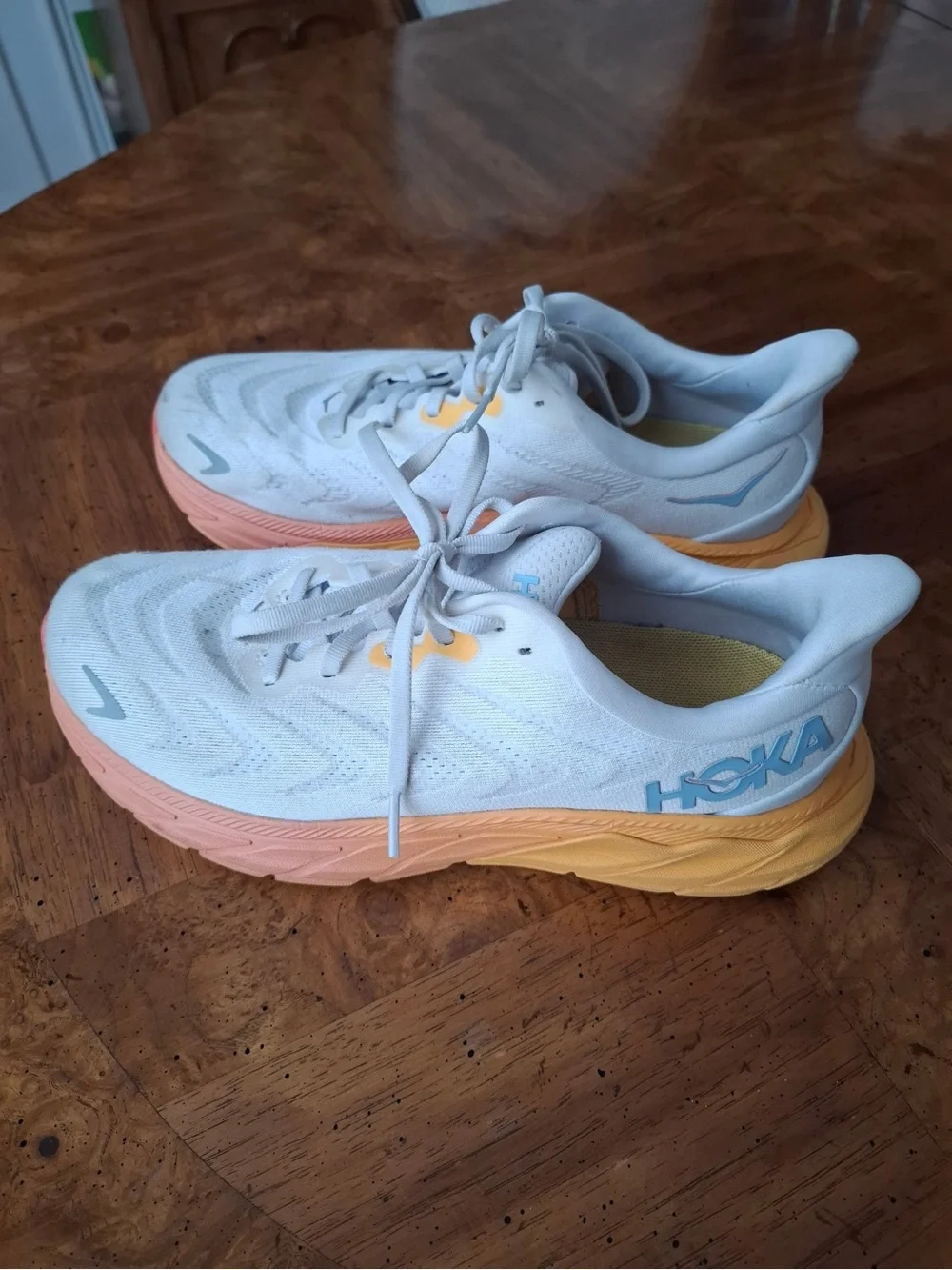 Hoka Women's White Running Shoes with Peach and Yellow Gradient Sole